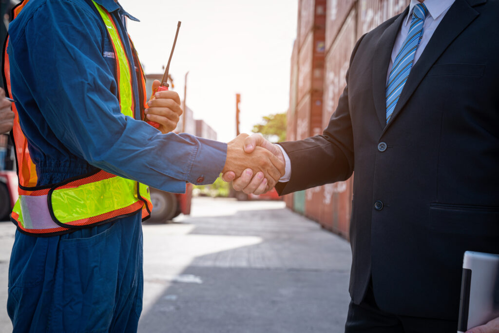 contractor and manager shaking hands